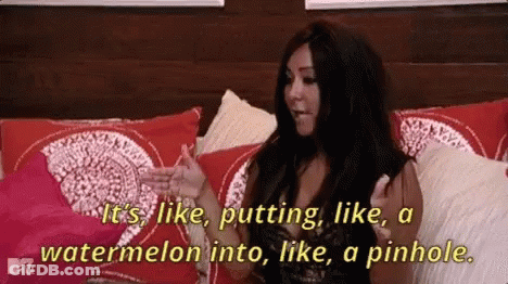 A Woman Is Sitting On A Bed And Saying It 'S Like Putting Like A Watermelon Into Like A Pinhole .. GIF