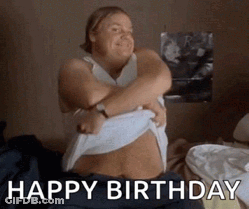 A Woman Is Sitting On A Bed With Her Arms Around Her Stomach . GIF