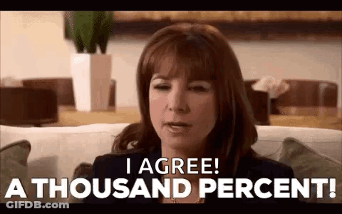 A Woman Is Sitting On A Couch And Saying `` I Agree ! A Thousand Percent '' . GIF