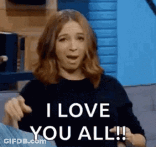 A Woman Is Sitting On A Couch And Saying `` I Love You All ! '' GIF
