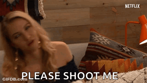 A Woman Is Sitting On A Couch And Saying Please Shoot Me GIF