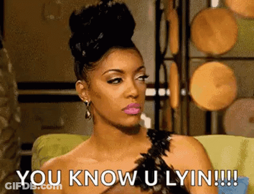 A Woman Is Sitting On A Couch And Saying `` You Know U Lyin !!! '' GIF