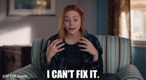 A Woman Is Sitting On A Couch And Says `` I Can 'T Fix It '' . GIF