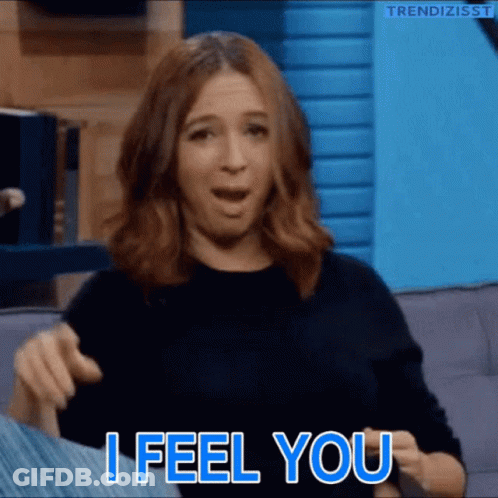 A Woman Is Sitting On A Couch And Says " I Feel You " GIF