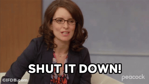 A Woman Is Sitting On A Couch And Says Shut It Down GIF