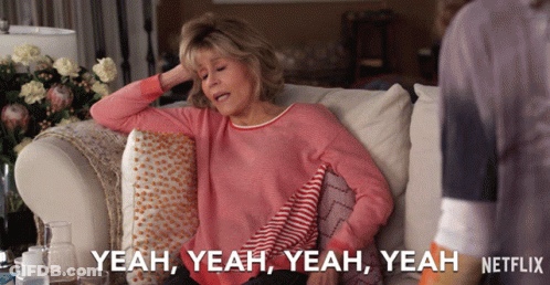 A Woman Is Sitting On A Couch And Says Yeah Yeah Yeah GIF