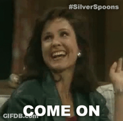 A Woman Is Sitting On A Couch And Smiling While Saying `` Come On '' . GIF