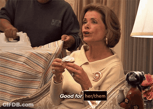 A Woman Is Sitting On A Couch Holding A Cupcake And Saying " Good For Her / Them " GIF