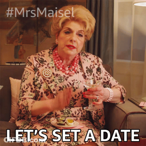 A Woman Is Sitting On A Couch Holding A Glass Of Wine And Saying " Let 'S Set A Date " .. GIF