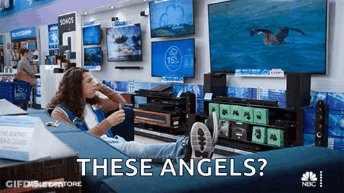A Woman Is Sitting On A Couch In A Store With The Words " These Angels " Written Above Her GIF