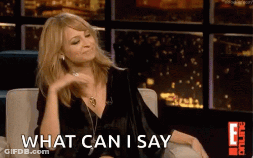 A Woman Is Sitting On A Couch In Front Of A Window And Saying What Can I Say . GIF