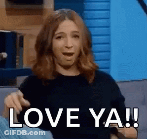 A Woman Is Sitting On A Couch Making A Funny Face And Saying `` Love Ya ! '' GIF