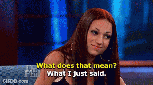 A Woman Is Sitting On A Couch Talking About What Does That Mean . GIF