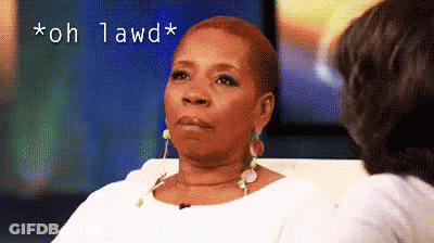 A Woman Is Sitting On A Couch Talking To Another Woman And The Words " Oh Lawd " Are Above Her GIF