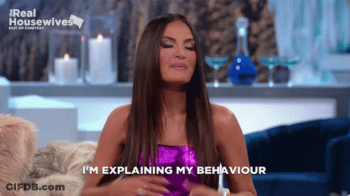 A Woman Is Sitting On A Couch With Her Eyes Closed And Says I 'M Explaining My Behavior GIF