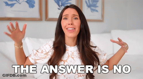 A Woman Is Sitting On A Couch With Her Hands In The Air And The Words The Answer Is No Behind Her GIF