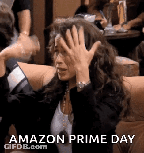 A Woman Is Sitting On A Couch With Her Hands On Her Head And The Words Amazon Prime Day Written On The Bottom GIF