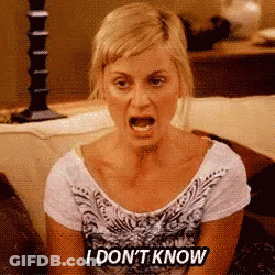 A Woman Is Sitting On A Couch With Her Mouth Open And Says I Don 'T Know GIF