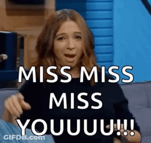 A Woman Is Sitting On A Couch With Her Mouth Open And Says `` Miss Miss Miss You !!! '' GIF