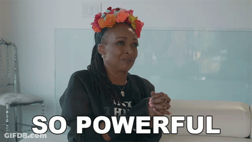 A Woman Is Sitting On A Couch With The Words So Powerful Behind Her GIF