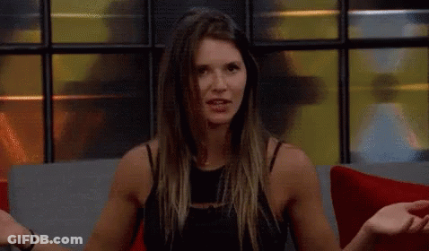 A Woman Is Sitting On A Couch With The Words You 'Re Delusional In Yellow Letters GIF