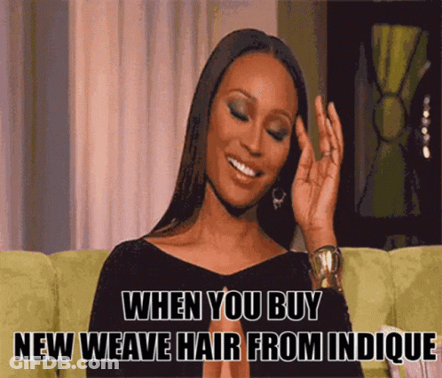 A Woman Is Sitting On A Green Couch With A Caption That Says When You Buy New Weave Hair From Indicque GIF
