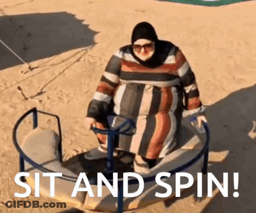 A Woman Is Sitting On A Merry Go Round With The Words Sit And Spin Written Below Her GIF