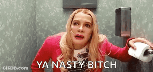 A Woman Is Sitting On A Toilet Holding A Roll Of Toilet Paper And Saying `` Ya Nasty Bitch '' . GIF