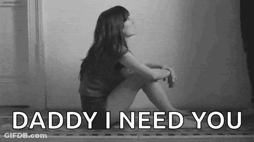 A Woman Is Sitting On The Floor With The Words `` Daddy I Need You '' . GIF
