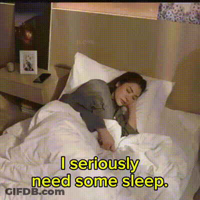A Woman Is Sleeping In A Bed With The Words " I Seriously Need Some Sleep " Below Her GIF
