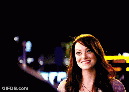 A Woman Is Smiling And Giving A Thumbs Up Sign GIF