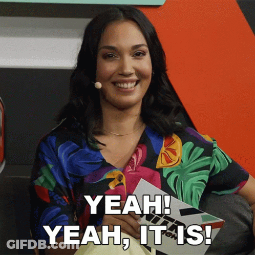 A Woman Is Smiling And Holding A Piece Of Paper That Says Yeah It Is GIF