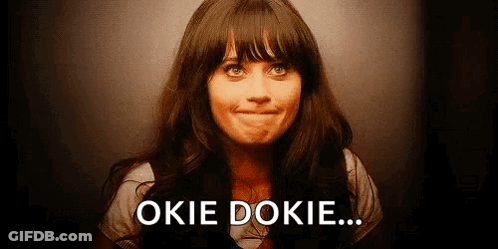 A Woman Is Smiling And Making A Face With The Words `` Okie Dokie '' Written On The Bottom Of Her Face . GIF