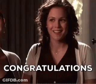 Woman Smiling And Saying Congratulations Next To Another Woman GIF