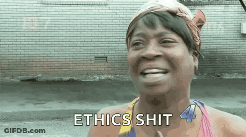 A Woman Is Smiling And Saying Ethics Shit In Front Of A Brick Building . GIF
