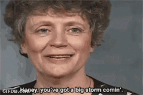 A Woman Is Smiling And Saying " Honey You 'Ve Got A Big Storm Comin " GIF
