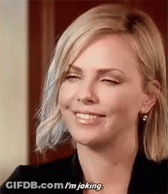 A Woman Is Smiling And Saying `` I 'M Joking . '' GIF