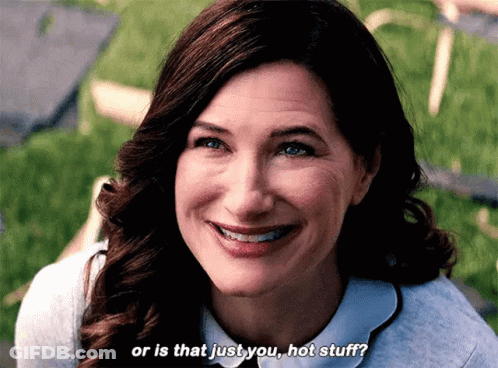 A Woman Is Smiling And Saying Or Is That Just You Hot Stuff . GIF