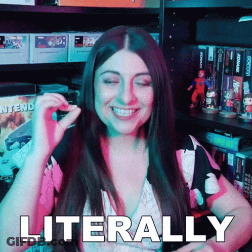 A Woman Is Smiling And Says Literally In Front Of A Video Game Shelf GIF