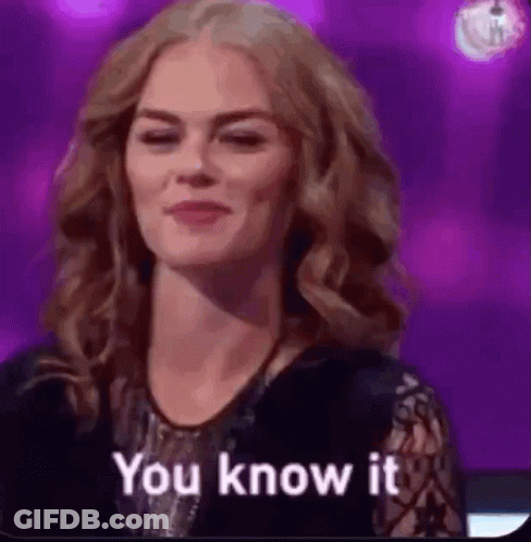 A Woman Is Smiling And Says `` You Know It '' . GIF