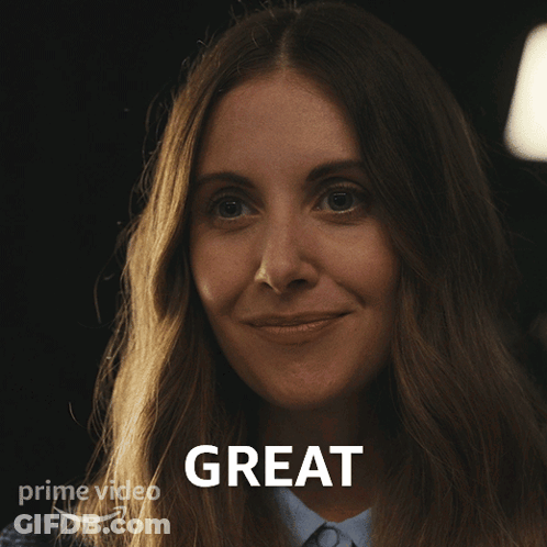 A Woman Is Smiling In Front Of A Sign That Says " Great " GIF