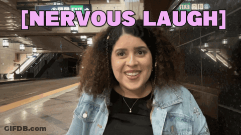 A Woman Is Smiling In Front Of A Sign That Says [ Nervous Laugh ] GIF
