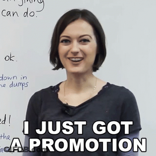 A Woman Is Smiling In Front Of A White Board That Says I Just Got A Promotion GIF