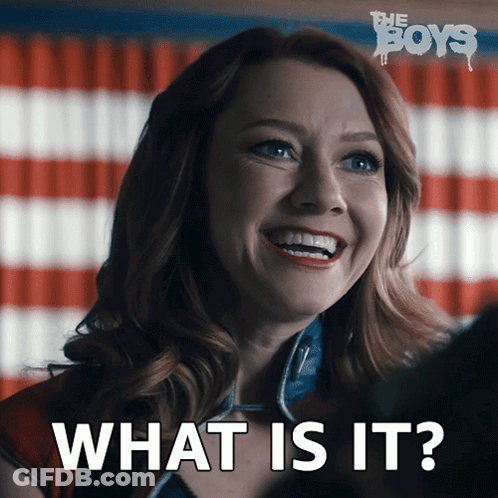 A Woman Is Smiling In Front Of An American Flag And Says What Is It GIF