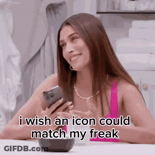 A Woman Is Smiling While Holding A Cell Phone And Saying I Wish An Icon Could Match My Freak GIF
