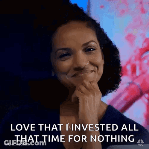 A Woman Is Smiling While Holding Her Hand To Her Chin And Saying `` Love That I Invested All That Time For Nothing '' . GIF