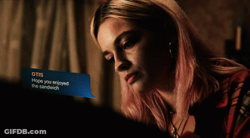 A Woman Is Smiling While Looking At A Message That Says Otis Hope You Enjoyed The Sandwich GIF