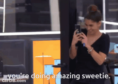 A Woman Is Smiling While Looking At Her Phone And The Words You 'Re Doing Amazing Sweetie Are Next To Her GIF