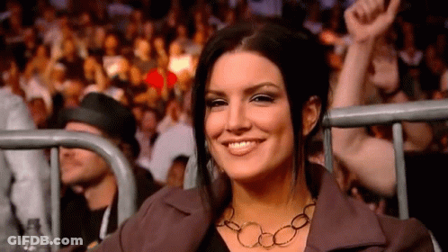 Woman Smiling At Boxing Match GIF