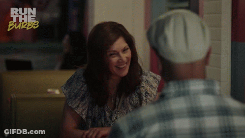 A Woman Is Smiling While Talking To A Man And The Words You 'Re So Funny GIF